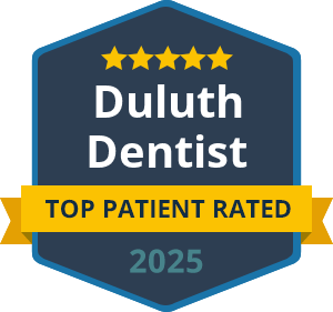 A badge with five stars reading "Duluth Dentist, Top Patient Rated, 2025.